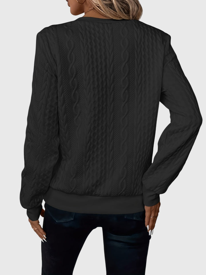Women's relaxed fit cable knit quarter-zip sweater, cozy and perfect for lounging.