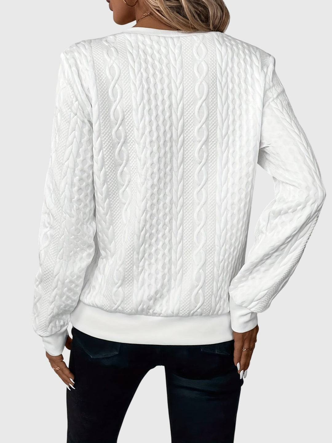 Classic women's navy cable knit quarter-zip sweater, perfect for casual layered looks.