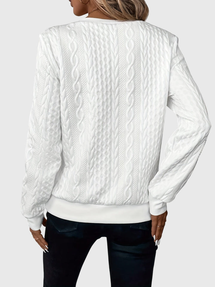 Classic women's navy cable knit quarter-zip sweater, perfect for casual layered looks.