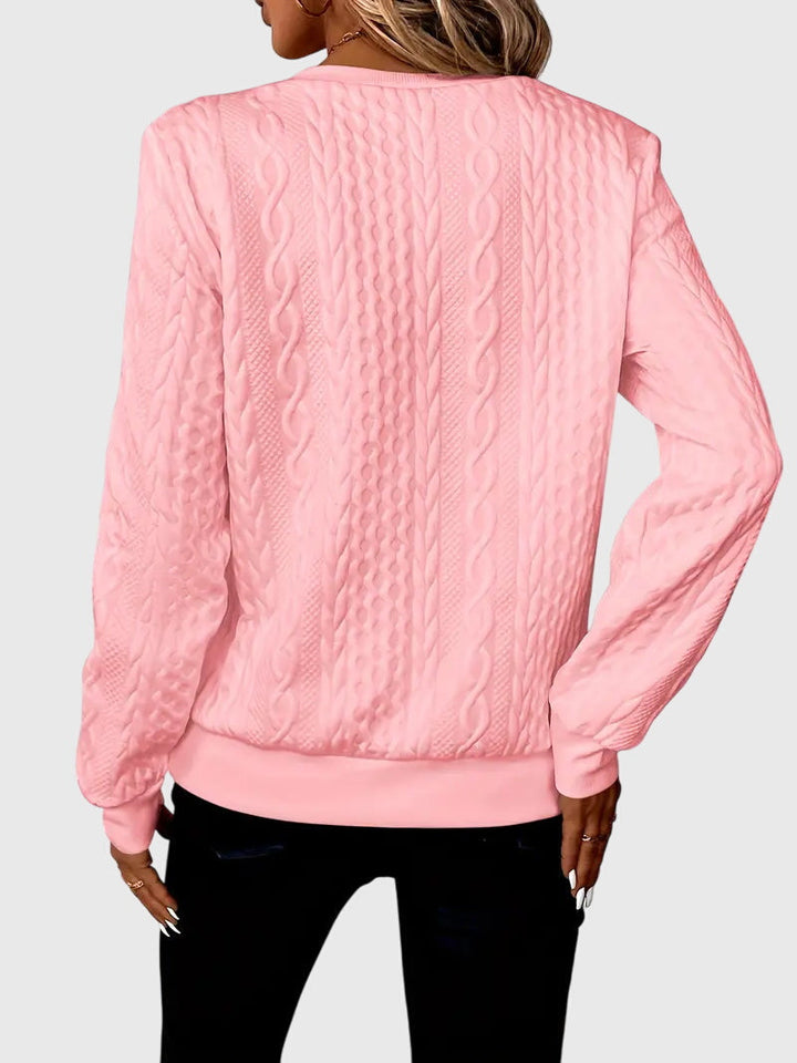 Sporty women's charcoal cable knit quarter-zip sweater, active casual style.