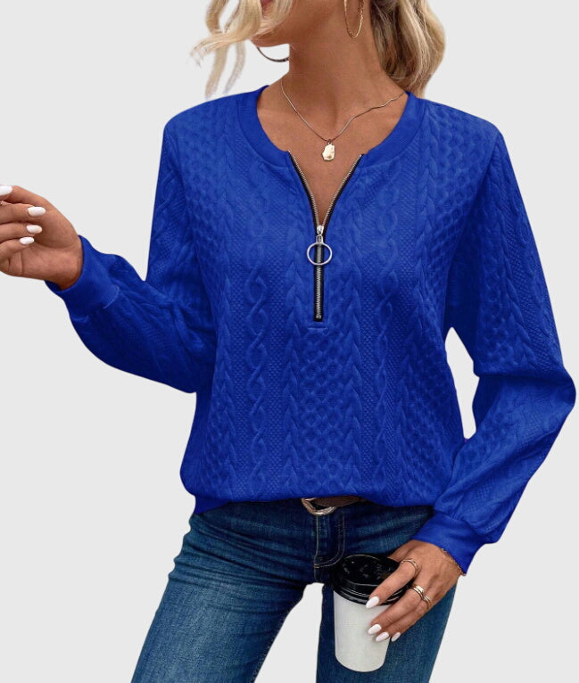 Everyday women's teal cable knit quarter-zip sweater, combining style and warmth.