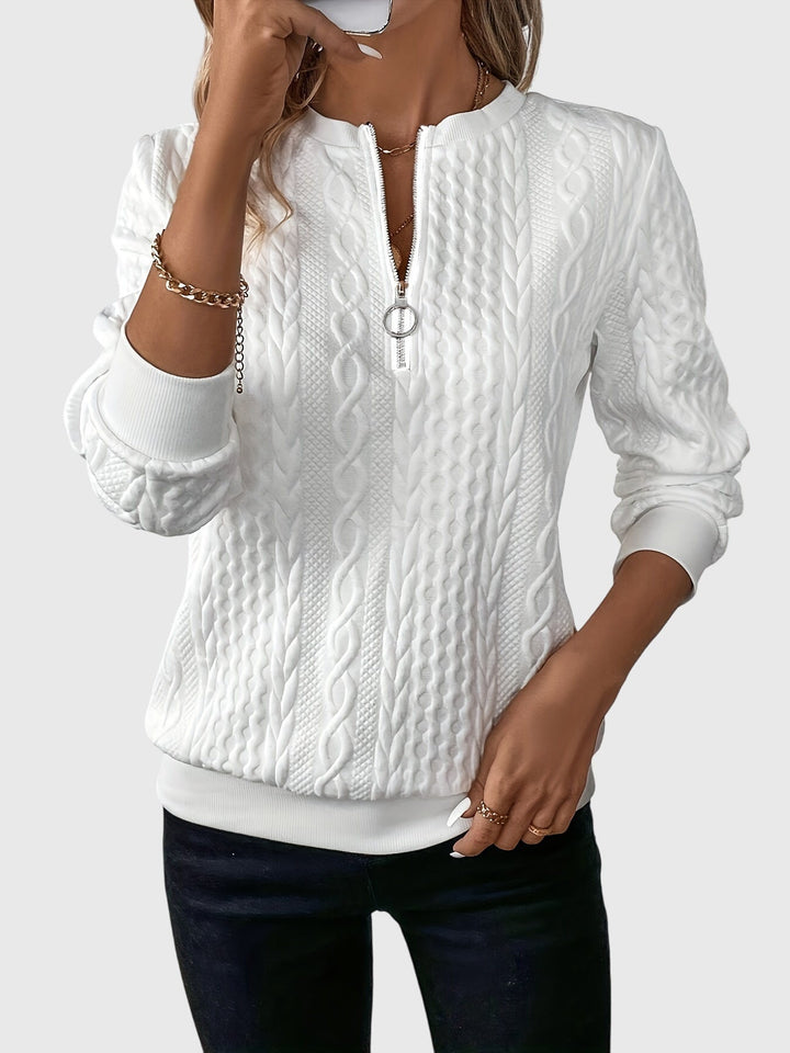 Soft women's grey cable knit pullover with quarter-zip, textured for cozy winter style.