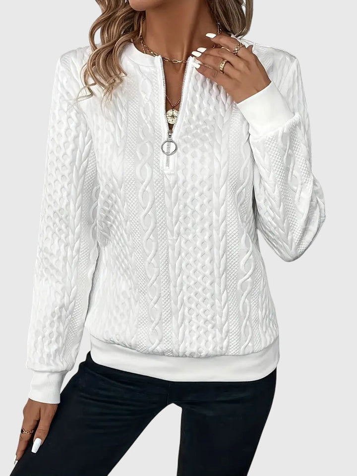 Textured women's forest green cable knit quarter-zip sweater, a warm layering piece.