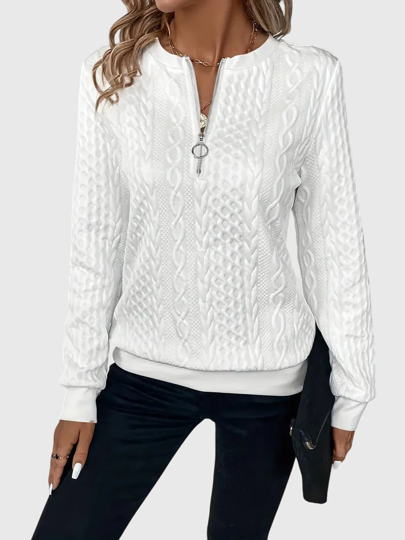 Elegant women's white cable knit quarter-zip pullover, perfect for crisp winter days.