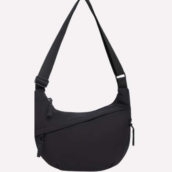 Elegant women's shoulder bag, crescent shape, featuring intricate braided detail. Versatile purse.