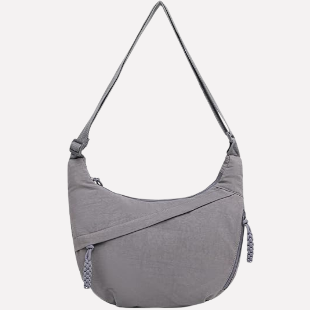 Fashion-forward women's crescent crossbody purse. Unique braided handle detail for style.