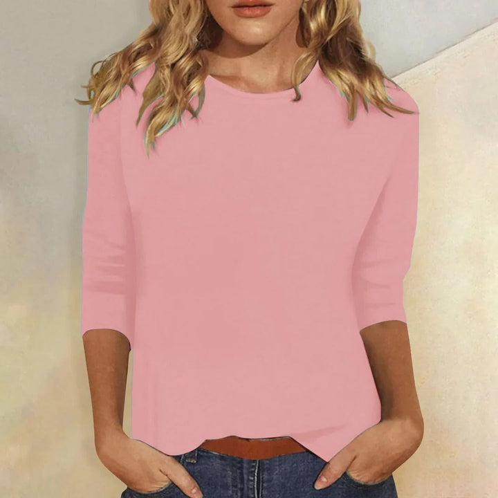 Women's crew neck 3/4 sleeve relaxed fit top in soft fabric, perfect for casual everyday wear.