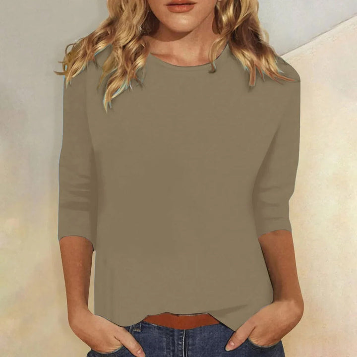 Casual women's crew neck 3/4 sleeve top, relaxed fit, an essential for comfortable everyday style.