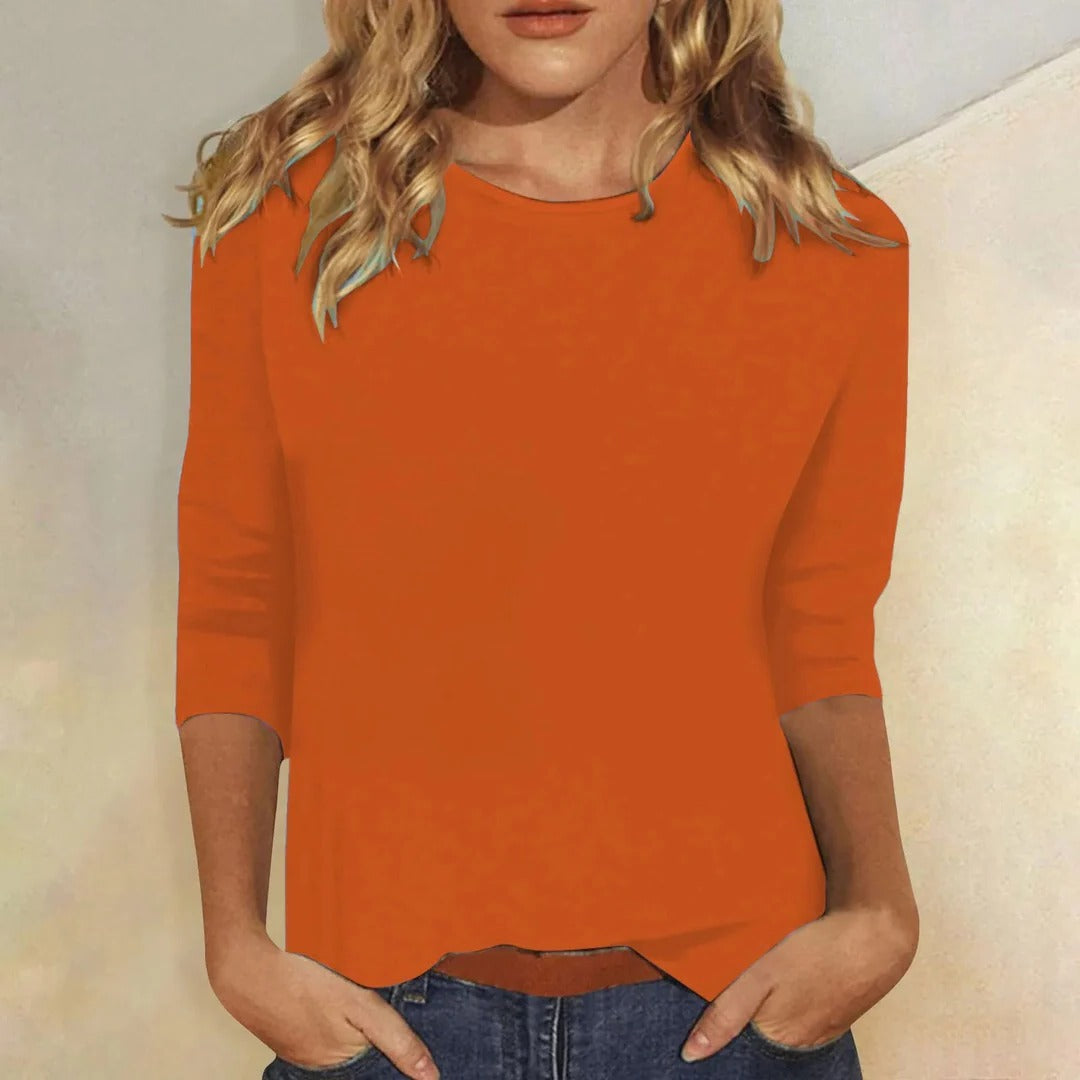 Soft women's relaxed fit crew neck 3/4 sleeve top, perfect for layering and versatile fashion.