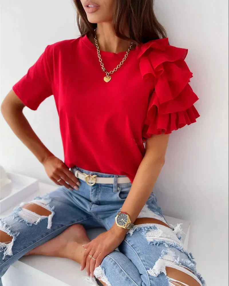 Fashionable women's top: crew neck tee with unique asymmetrical tiered ruffle sleeves. Versatile & elegant.