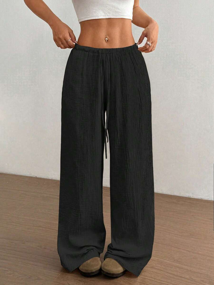 Light & airy women's crinkled wide leg summer pants with a comfortable drawstring elastic waist.