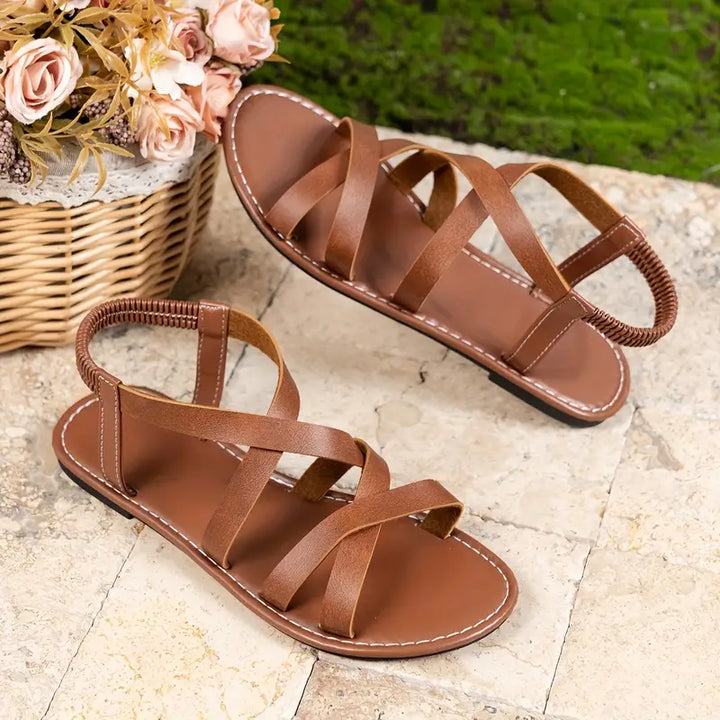 Comfortable women's flat sandals, criss-cross straps, Roman style, great for beach & vacation.