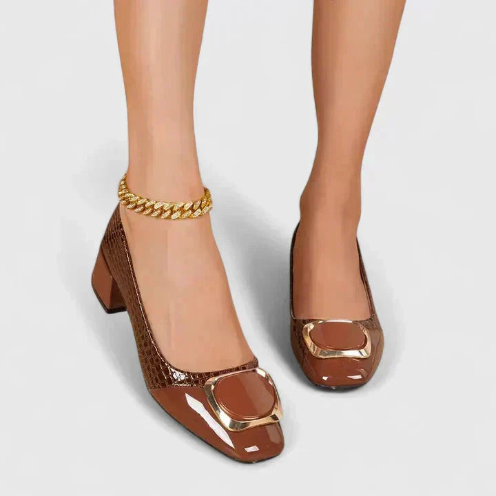 Croc embossed women's block heel loafers with a sophisticated gold buckle. Comfortable and stylish office flats.