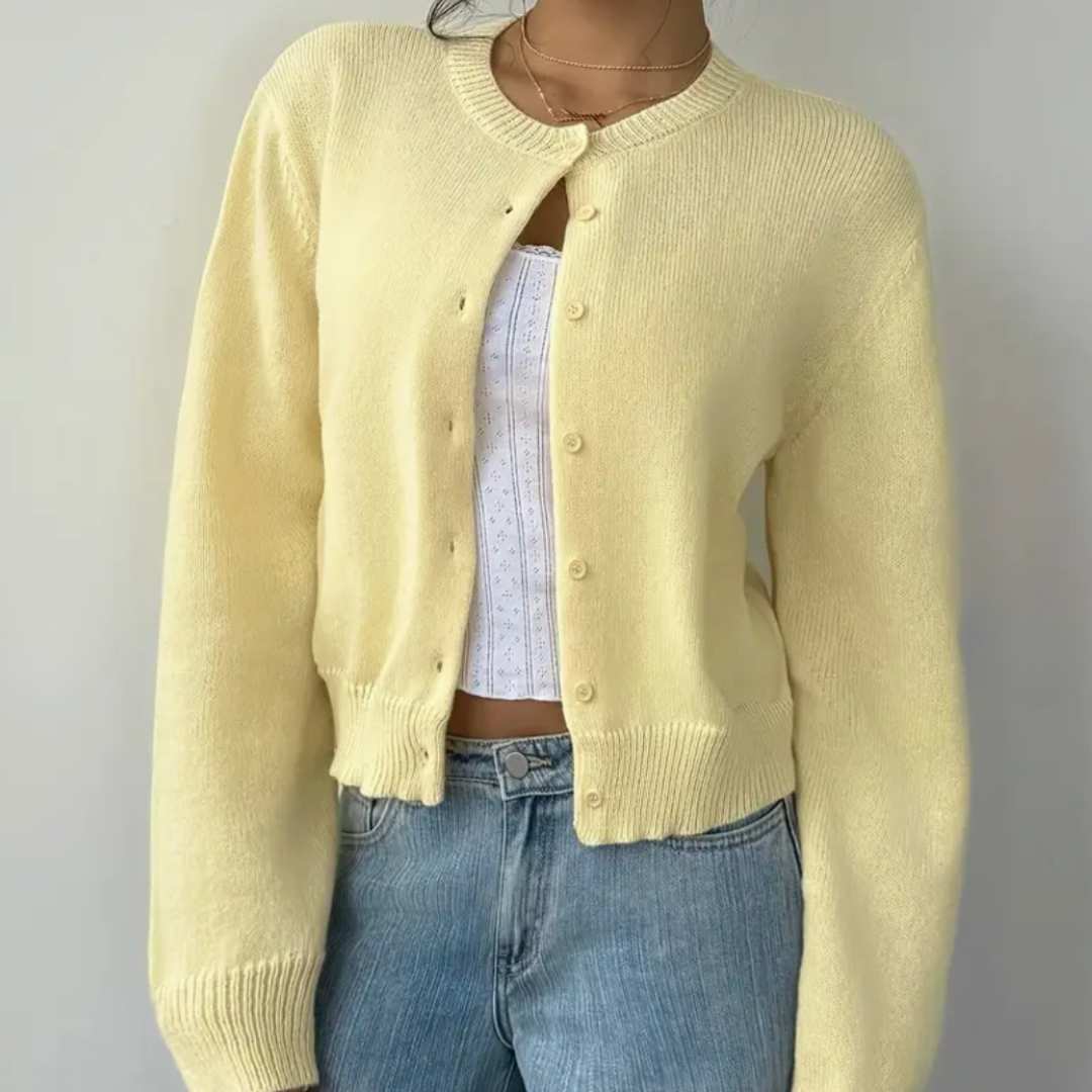 Trendy women's cropped cardigan in a soft lilac shade, ideal for stylish spring layering.