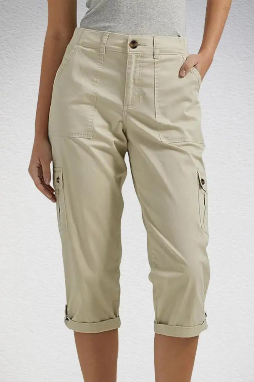 Front view of women's cropped cargo pants. Relaxed fit capris with visible utility pockets & comfortable waistband.