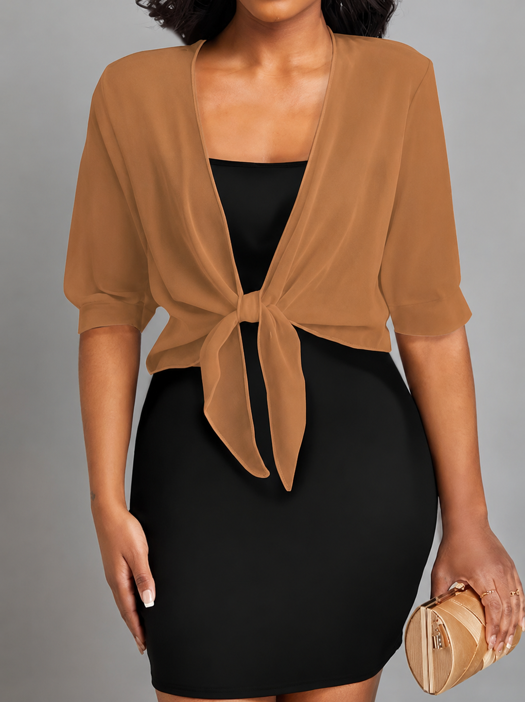 Stylish women's cropped bolero, sheer fabric, tie-front closure, and half sleeves.