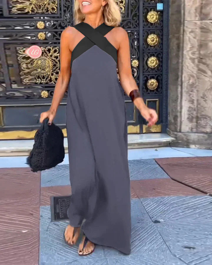 Long women's cross neck maxi dress, flowy & flattering. Ideal for casual evening elegance.