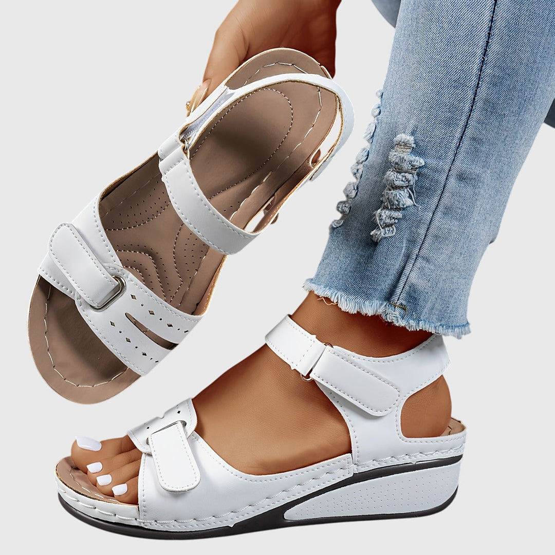 Supportive women's walking sandals with crystal details, great for summer comfort.