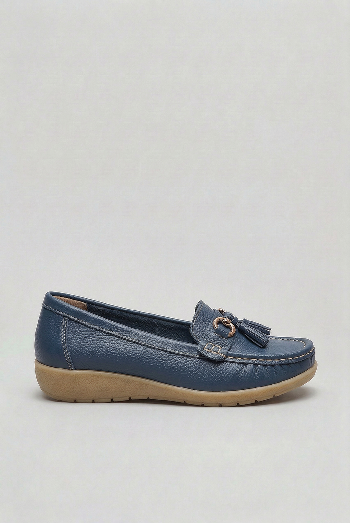 Woman walking in comfortable slip-on loafers. Cushioned women's footwear for everyday versatile wear.
