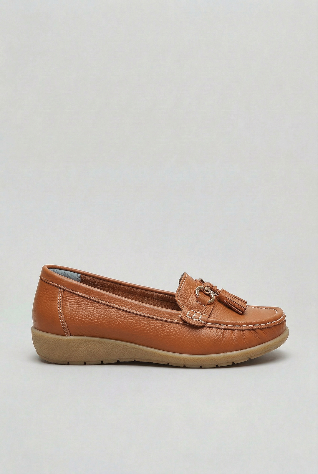 Plush interior of women's cushioned loafers. Providing ultimate comfort for everyday flat footwear.