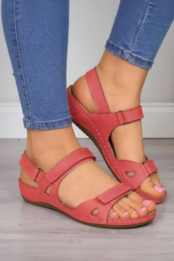 Cushioned footbed women's walking sandals with adjustable hook-and-loop straps for everyday comfort.