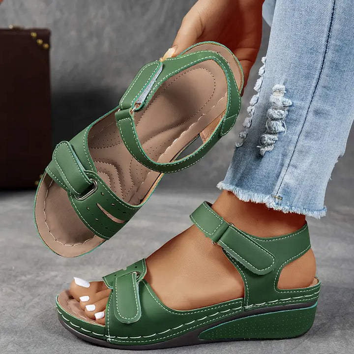 Stylish ladies' wedge sandals, hook and loop adjustable strap, ergonomic comfort for everyday wear.