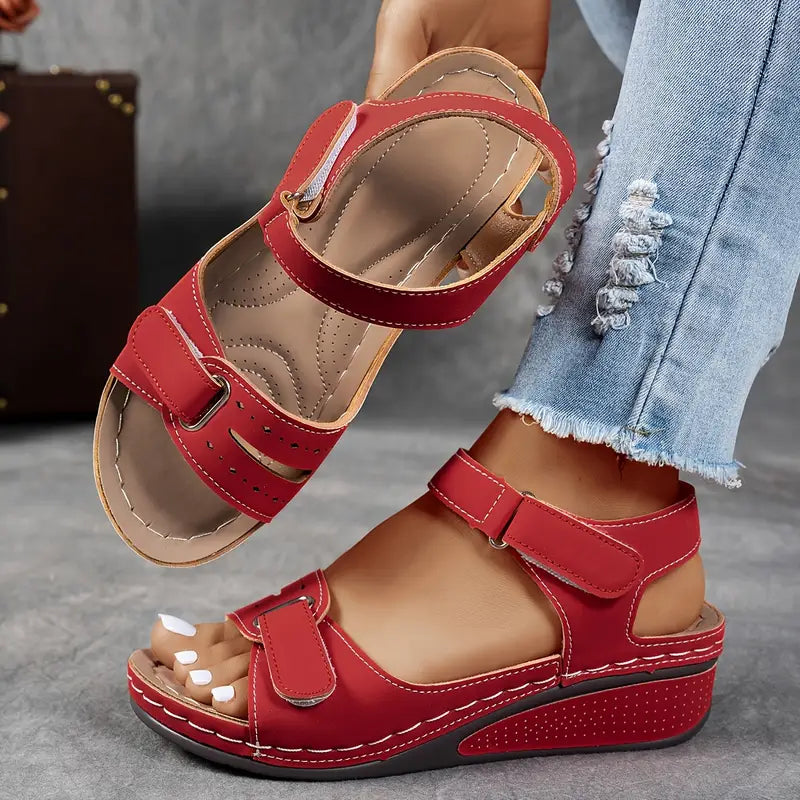 Fashionable women's wedge sandals featuring adjustable straps & cushioned footbed for ultimate casual comfort.