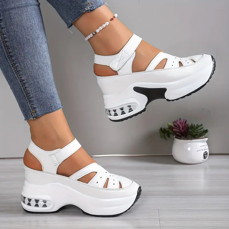 Women's comfort wedge sandals, cushioned platform, breathable cutouts, adjustable strap, closed toe support.