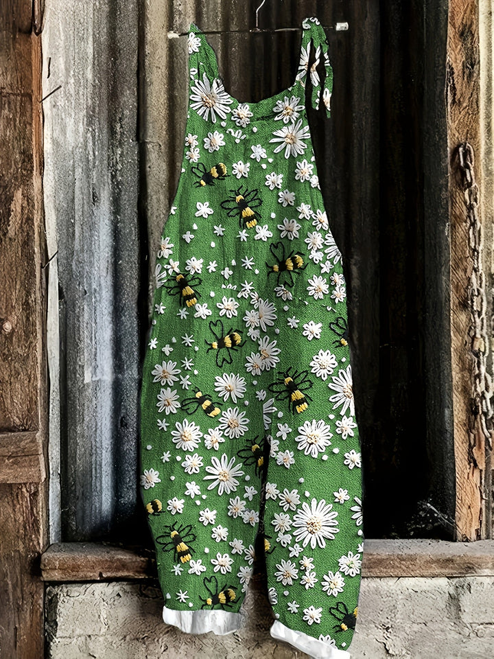 Chic women's casual jumpsuit with a unique daisy & bee pattern, adjustable tie shoulders & relaxed fit.