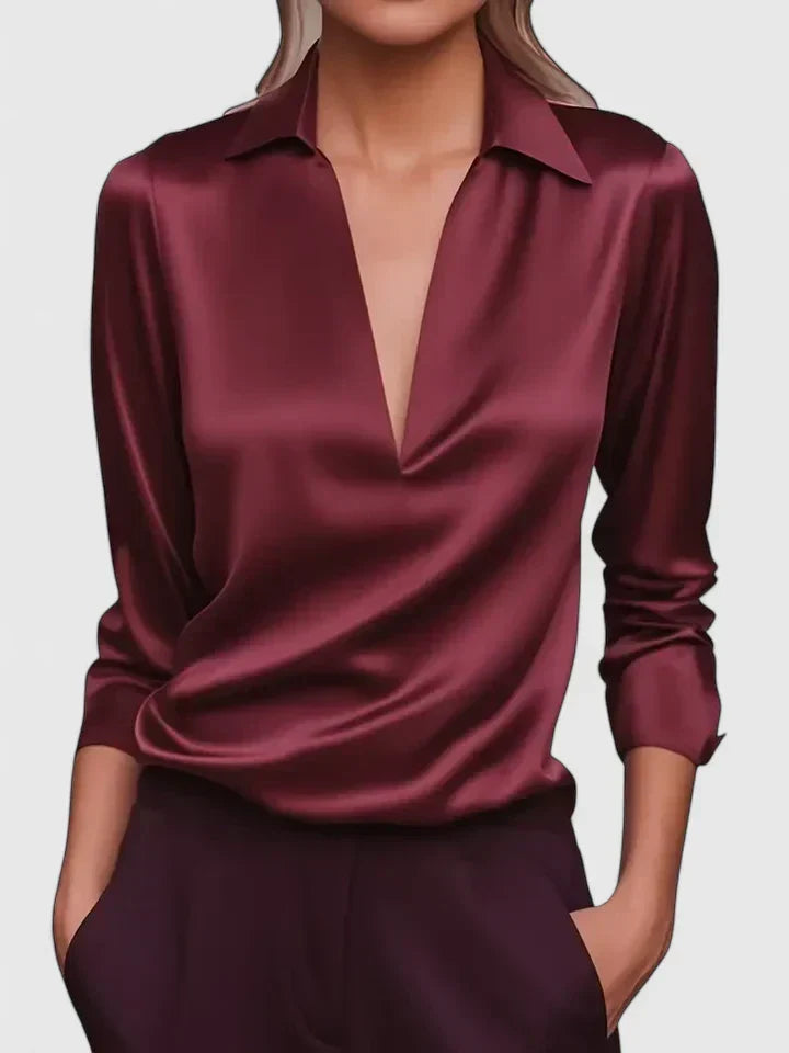 Sophisticated women's relaxed fit blouse featuring a deep V-neck and elegant draped long sleeves.