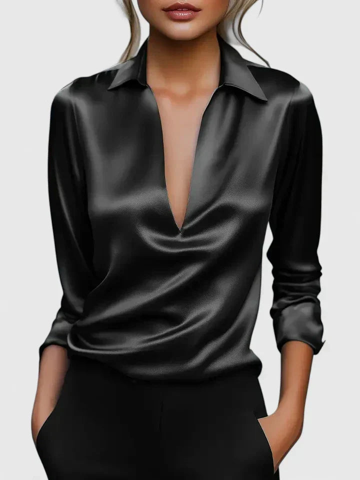 Comfortable women's relaxed long sleeve blouse featuring a deep V-neck and elegant draped detailing.