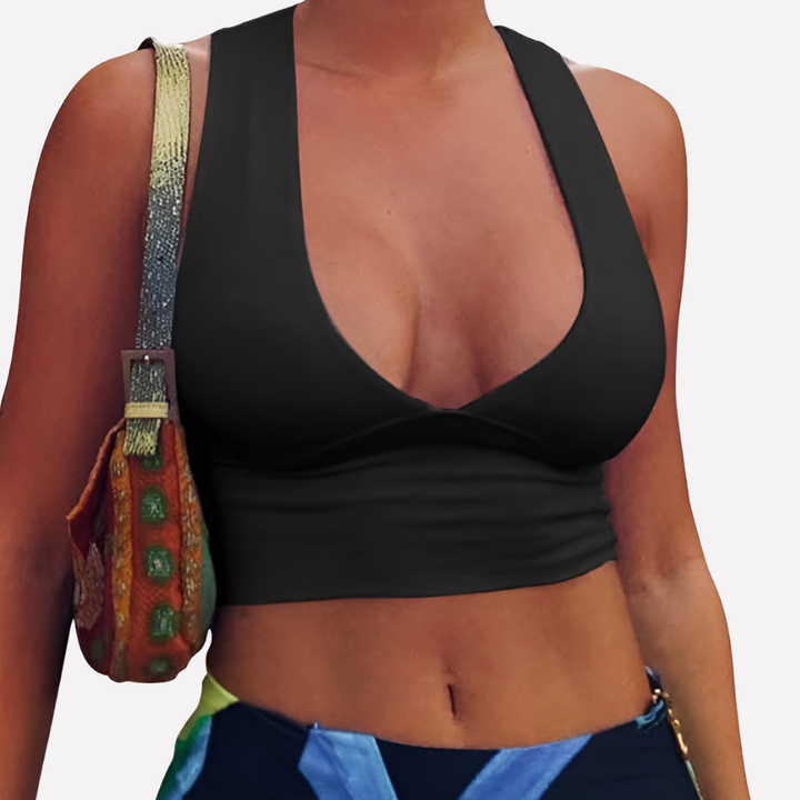 Fitted sleeveless women's crop top, featuring a deep V-neck, racerback, and chic cutout design for summer.