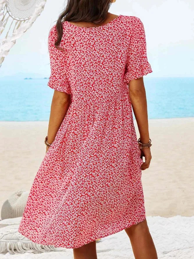 Flowy ditsy floral print mini dress for women, featuring elegant flutter sleeves. Ideal casual or vacation outfit.
