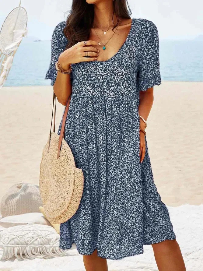 Chic women's ditsy floral print mini dress, designed with flattering flutter sleeves for a breezy summer look.