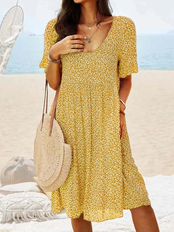Lightweight women's ditsy floral mini dress with flutter sleeves, a comfortable choice for warm summer days.