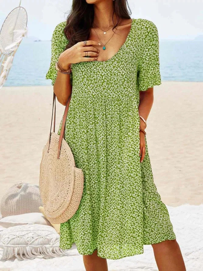 Stylish women's ditsy floral mini dress with flutter sleeves, versatile for beach, casual outings, or vacation.
