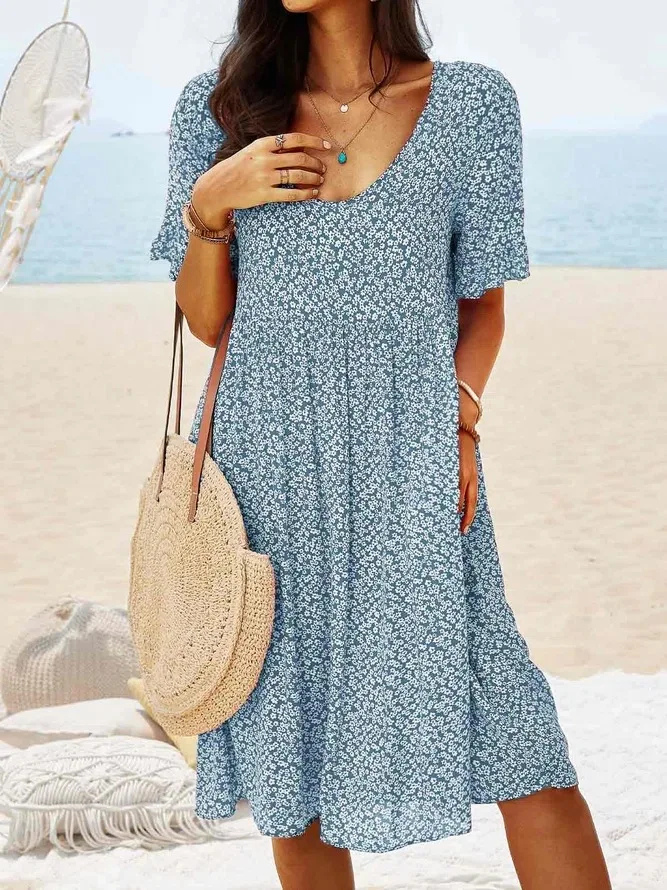 Elegant women's ditsy floral mini dress featuring delicate flutter sleeves, a perfect addition to your summer wardrobe.