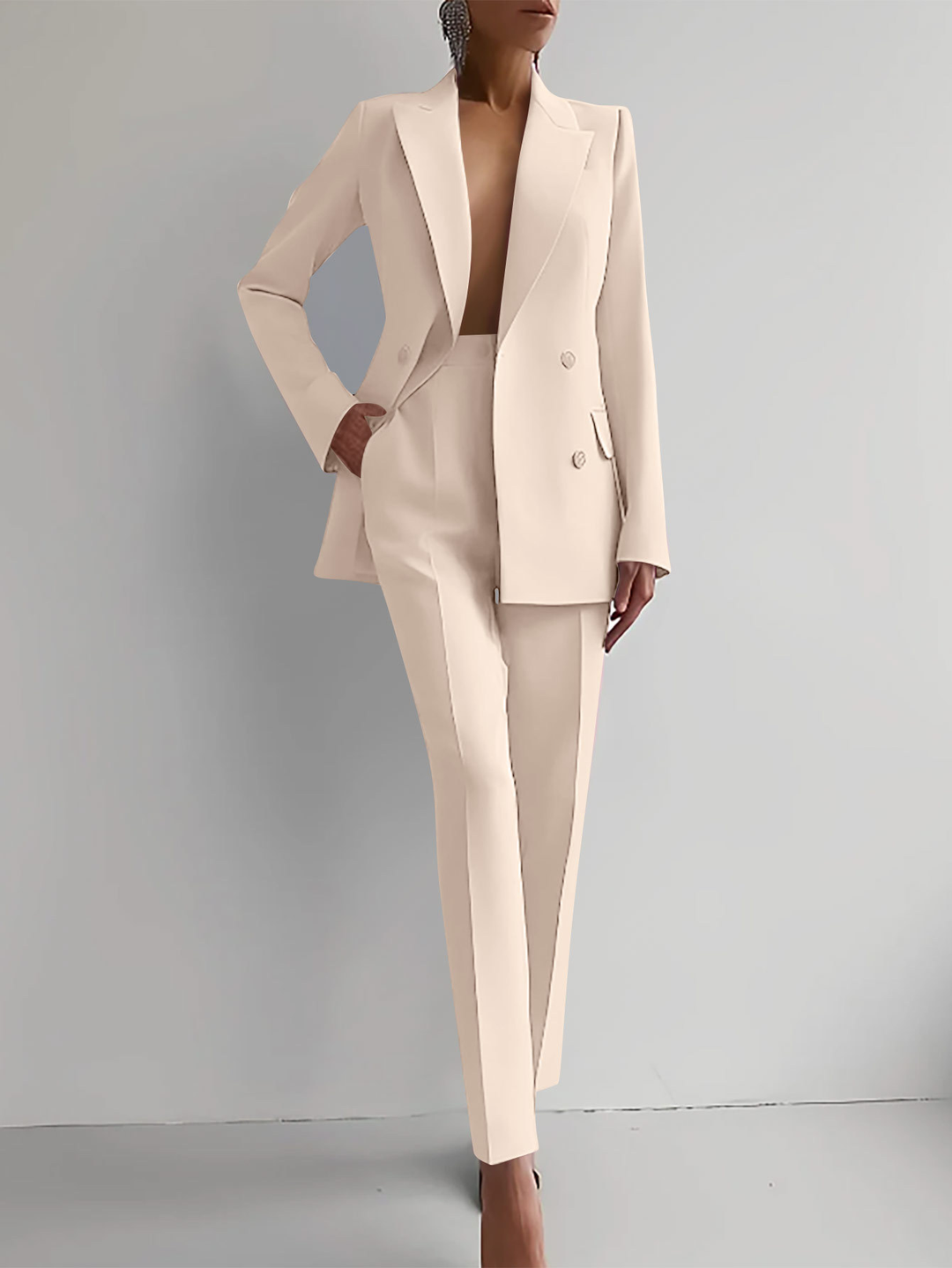 Premium tailored women's double-breasted blazer & slim trousers suit set. Elegant professional attire.