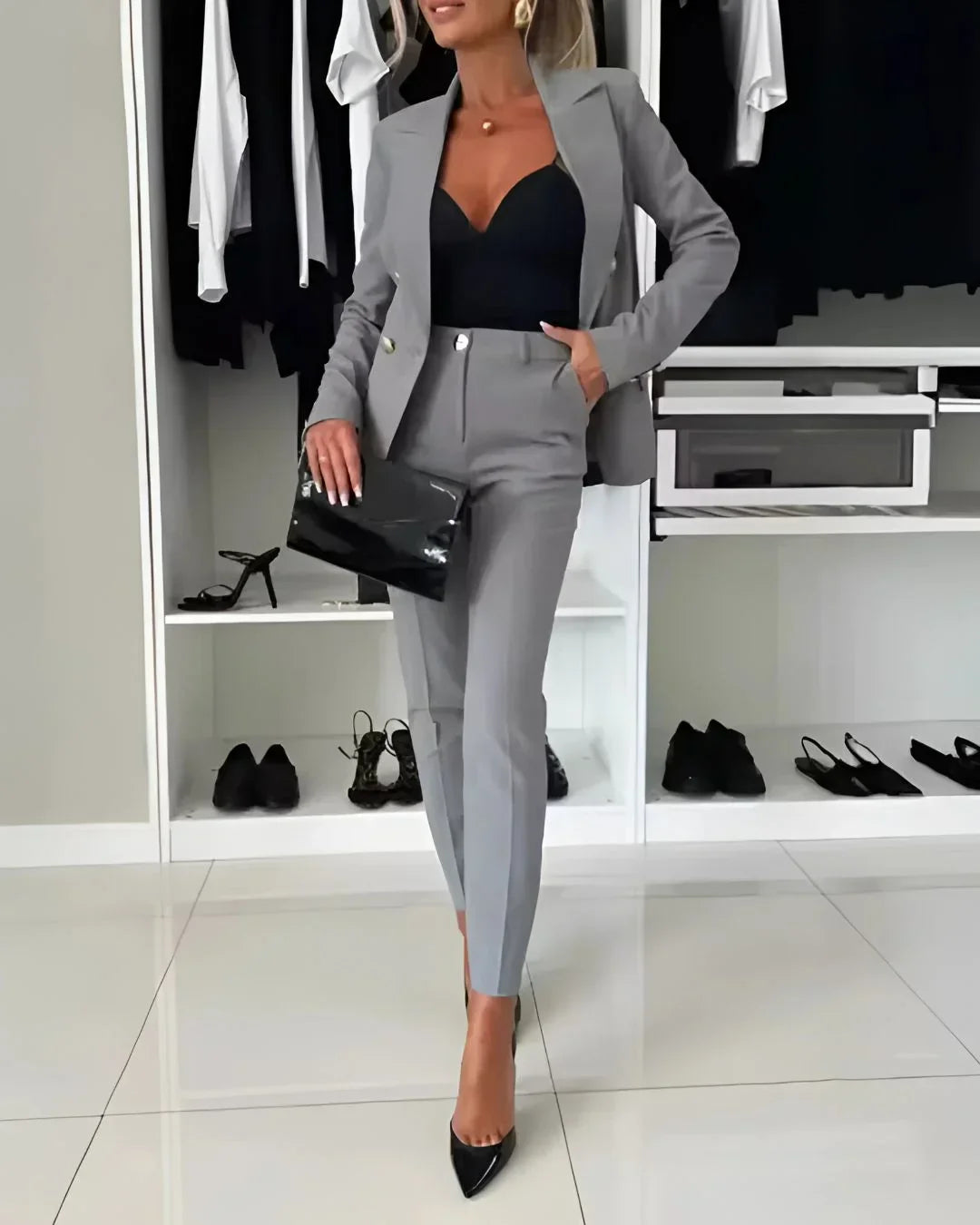Classic women's double-breasted suit & tailored trousers set, versatile for work & formal occasions.