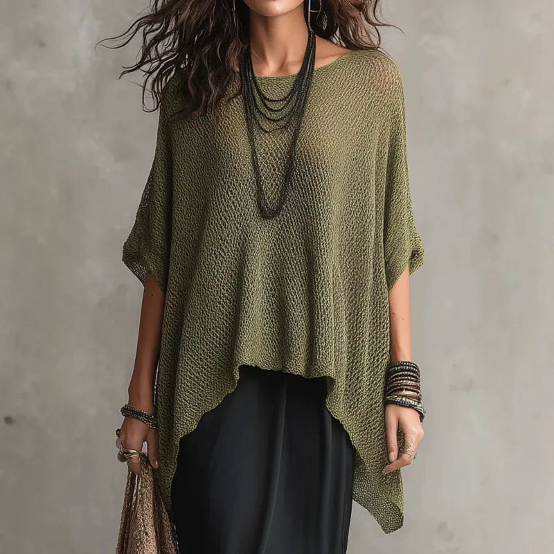 Chic women's boat neck poncho top, draped for a comfortable loose fit. Ideal for versatile casual spring/fall style.
