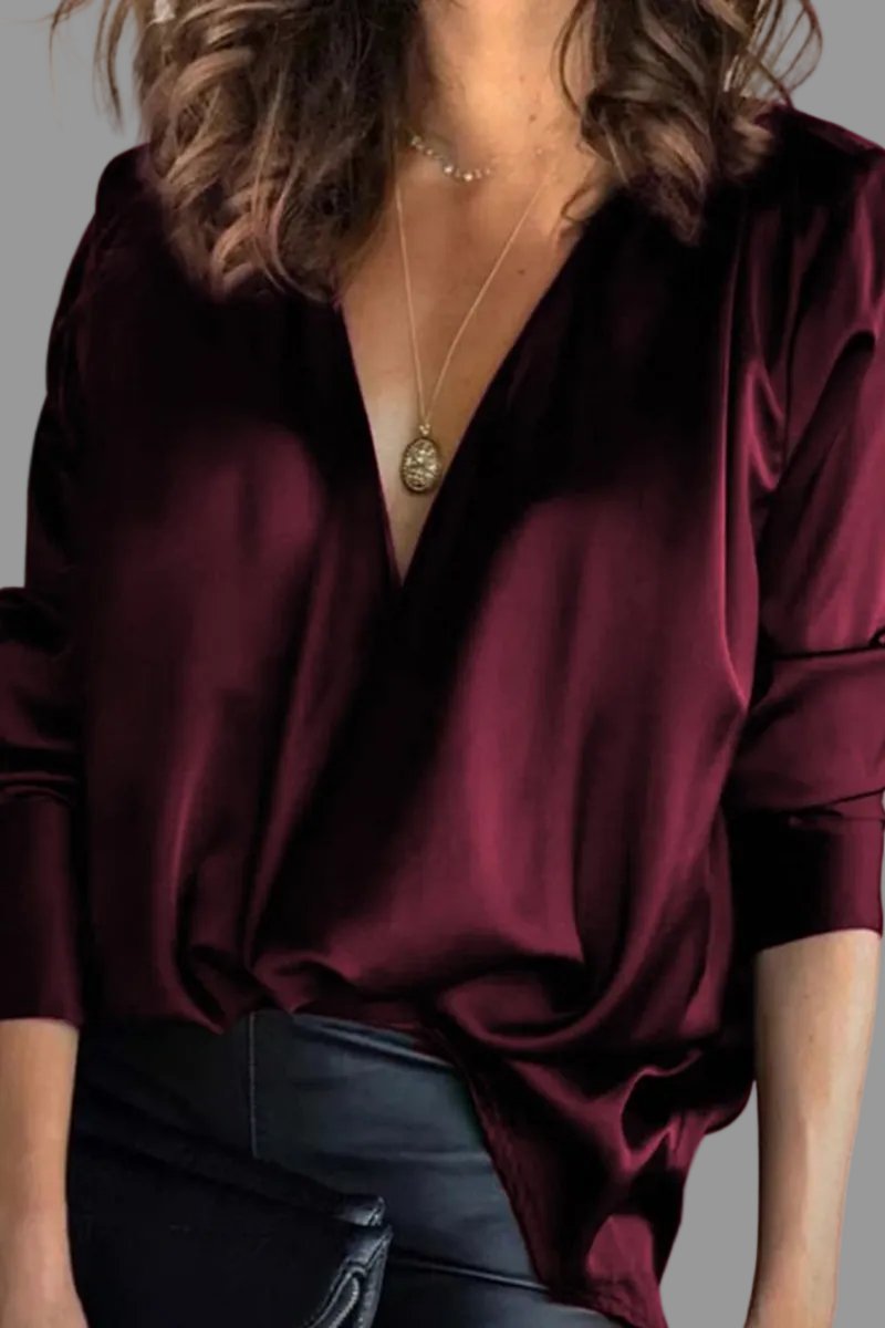 Shimmering women's draped V-neck blouse with long sleeves, relaxed fit, versatile for evening or casual chic.