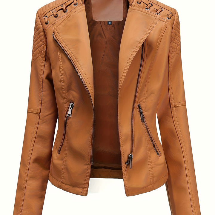 Close-up detail of the studded shoulders on an edgy women's zip-front moto jacket.