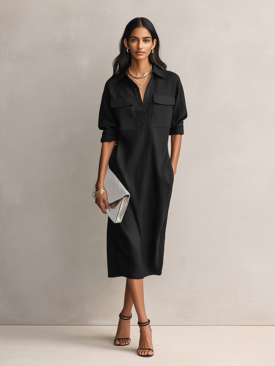 Casual women's black midi dress with a collar and elbow sleeves. An effortless and versatile shirt dress design.