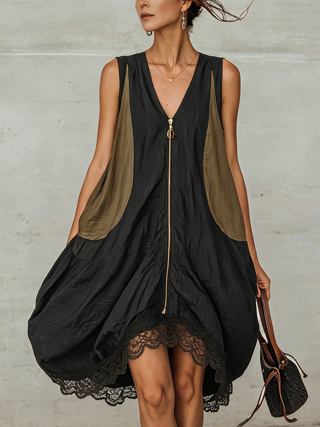 Women's effortless black midi dress with a flattering V-neckline and elegant lace trim hem, perfect for casual elegance.