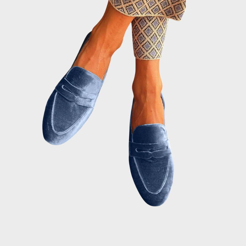 Women's effortless blue slip-on loafers, perfect for casual or office wear. Comfortable flats with classic style.