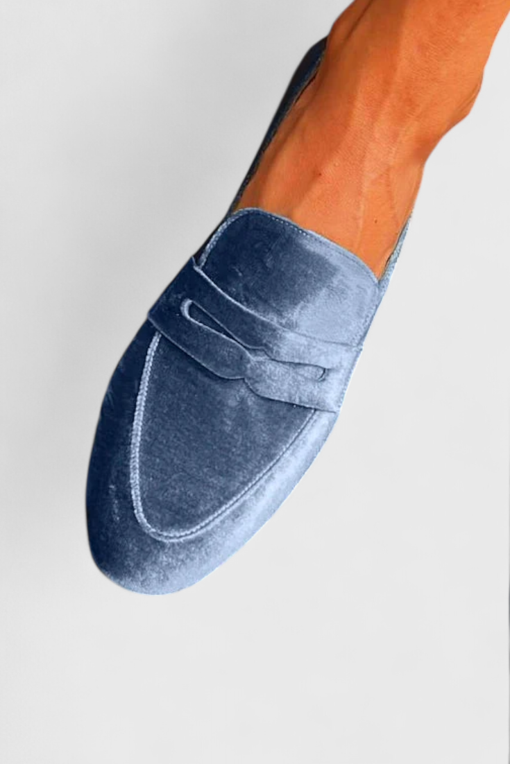 Classic women's blue slip-on loafers, offering effortless style & comfort. Versatile footwear for any casual or work occasion.
