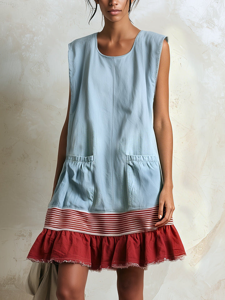 Women's effortless blue tiered mini dress with a charming ruffle hem. Perfect for summer casual wear.