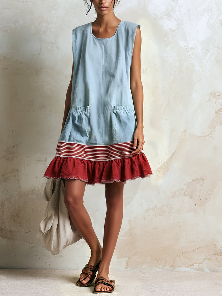Casual women's blue mini dress with a beautiful tiered ruffle hem. Your go-to for summer and resort wear.