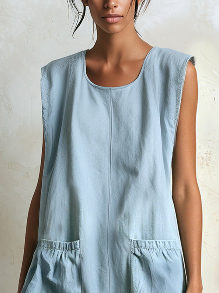 Sleeveless women's blue mini dress with a tiered ruffle hem, perfect for resort wear and warm summer evenings.
