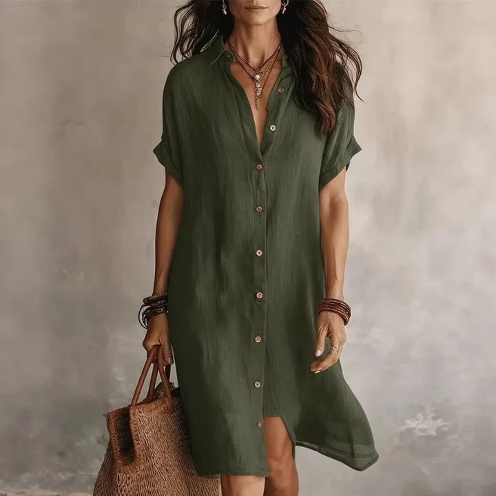 Close-up of the flowing fabric and button-front detail on this elegant women's midi dress, ideal for brunch.